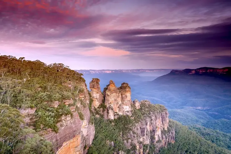 Three Sisters beneath a colourful evening sky