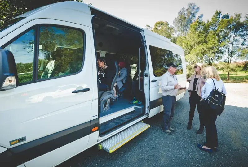 Guests boarding the tour vehicle