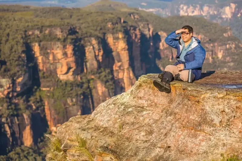 Visitor on a rocky mountain viewpoint